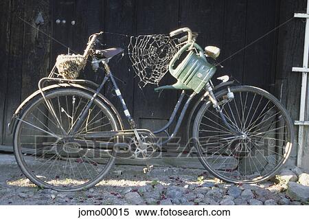 Stock Photography - bicycle, old, clapped-out, rickety, rusty, cobweb, watering can. Fotosearch