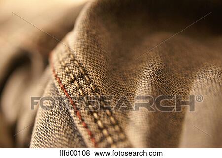 Stock Photo - close-up, cloth, sweetener, trousers, thread, redly, red. Fotosearch