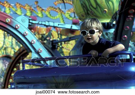 Picture - Day, CAROUSEL, comical, children, Kind, ride, amusement park. Fotosearch