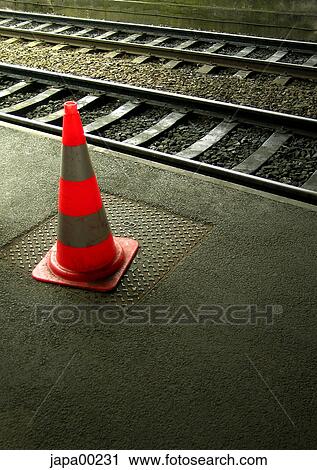 Stock Image - Day, palut, traffic cone, rails, railway, red, traffic. Fotosearch