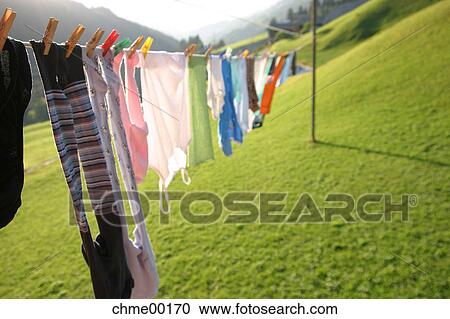 Stock Image - family-life, spring awakening, hygienics, clothesline, dry laundry, leash, wash. Fotosearch
