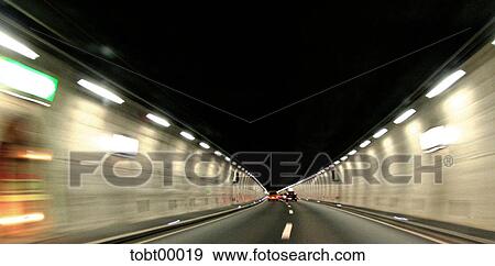 frightens, motorway, tunnel view, tunnel, neon light, curve, cars View Large Photo Image Stock Photo - frightens, motorway, tunnel view, tunnel, neon light, curve, cars. Fotosearch