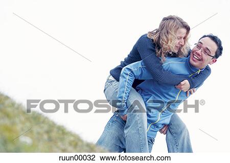 grass, couple, hang, pair, Love, woman View Large Photo Image Stock Image - grass, couple, hang, pair, Love, woman. Fotosearch