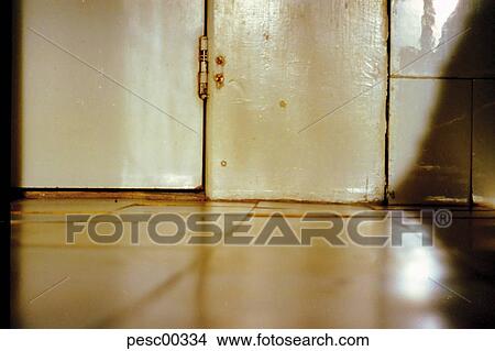 Picture - ground level, torturechamber, door, articulation, tiles, wooden door, tiled floor. Fotosearch