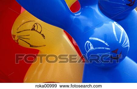 Stock Photo - hares, balloon, multicolored, colorful, colourful, colored, funfair. Fotosearch