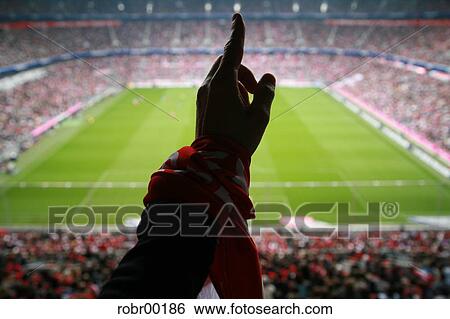 Stock Photograph - jubilation, ball, acclaim, delightedly, grass, hand, division. Fotosearch