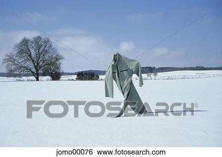 Stock Photograph - More haste, less speed, scarecrow, winter, cross-country skiing, headless, snow. Fotosearch