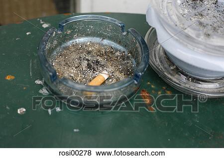 Stock Photo - nasty, ashtray, dirt, smoke, cigarette, ash. Fotosearch
