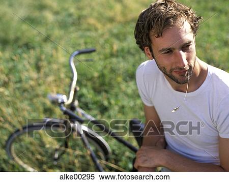 old bike, good-looking, short hair, close to nature, bicycle, spring awakening View Large Photo Image Stock Photography - old bike, good-looking, short hair, close to nature, bicycle, spring awakening. Fotosearch