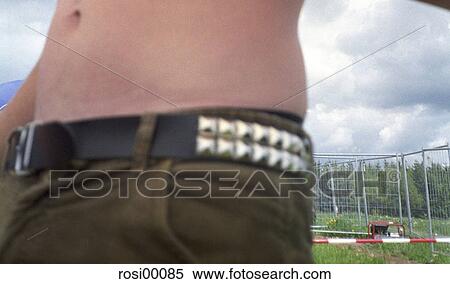 party tendency, skirt at the ring, camping, man belly, shorts, belt, blurred View Large Photo Image Stock Photography - party tendency, skirt at the ring, camping, man belly, shorts, belt, blurred. Fotosearch