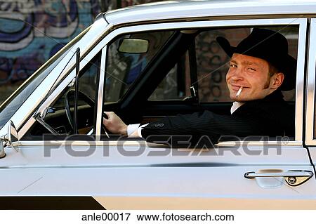 smoker, suit, deflection, sitting, drive, driving View Large Photo Image Stock Photo - smoker, suit, deflection, sitting, drive, driving. Fotosearch