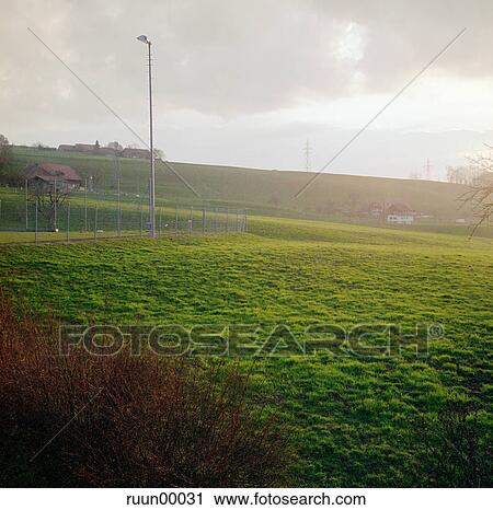 sun, grass, evening, evening-sun, setting sun, soccer field, football field View Large Photo Image Stock Image - sun, grass, evening, evening-sun, setting sun, soccer field, football field. Fotosearch