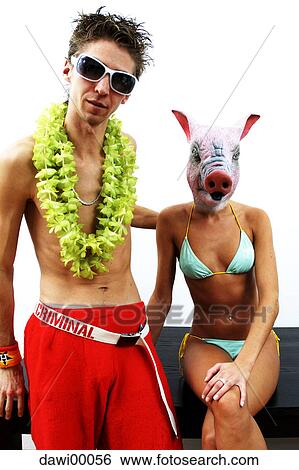 Stock Photograph - symbol of luck, pig, bikini, mask, easy-going, mask of a pig, woman. Fotosearch