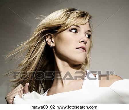 Stock Image - woman, flying hair, girl, face, blonde, blond, fair. Fotosearch