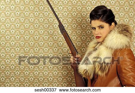 Stock Photo - woman, human, fur, dark hair, lipstick, face, visage. Fotosearch