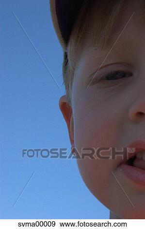 Stock Photo - young, half face, child, blonde, blond, fair, fair-haired. Fotosearch