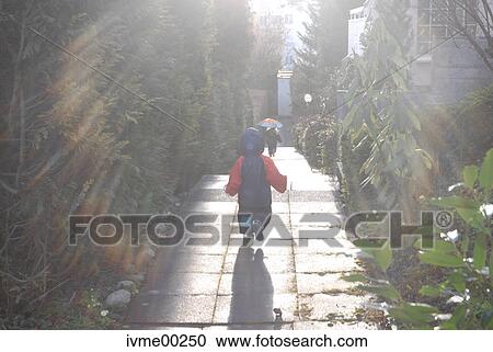 Stock Image - back light, light reflections, rain protection, rainday, living quarter, rain, sun. Fotosearch