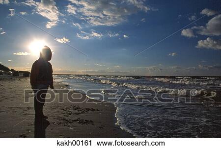beach, young, hood, coldness, cold, sky, clouds View Large Photo Image Stock Image - beach, young, hood, coldness, cold, sky, clouds. Fotosearch
