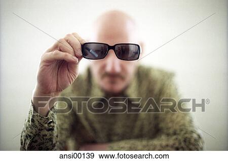 Stock Photo - black sun glasses, approach, portrait, silhouette, designer glasses, frontal, inside. Fotosearch