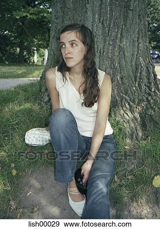 brown hair, grass, woman, young woman, portrait, natural, outdoor shot View Large Photo Image Stock Photo - brown hair, grass, woman, young woman, portrait, natural, outdoor shot. Fotosearch