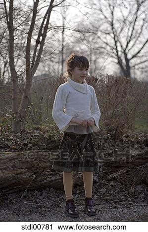 Stock Image - child, children, girl, laugh, pools, dance, trees. Fotosearch