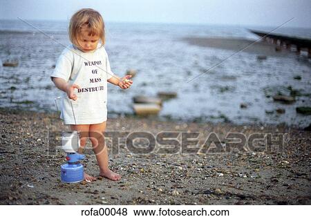 Stock Photo - child, whole body, beach, WEAPON OF MASS DESTRUCTION, girl, blonde, fair. Fotosearch