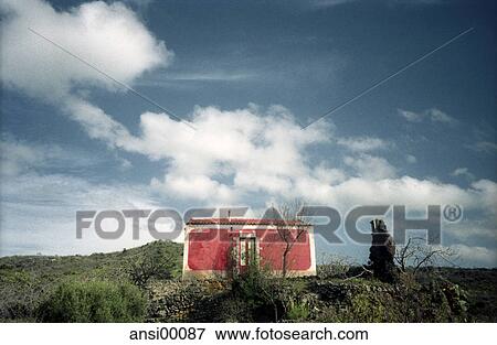 Stock Photo - cloudy, abandoned, blue sky, grass, left over, from bottom, frontal. Fotosearch