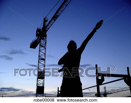 construction crane and humans, imitation, crane, sky, evening atmosphere, evening mood View Large Photo Image Stock Photo - construction crane and humans, imitation, crane, sky, evening atmosphere, evening mood. Fotosearch
