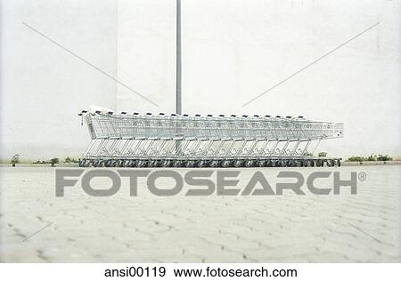 everyday life facilitation, familiar view, useful invention, beaded, on wheels, small wheel, shopping cart View Large Photo Image Stock Photo - everyday life facilitation, familiar view, useful invention, beaded, on wheels, small wheel, shopping cart. Fotosearch