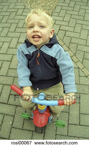 Stock Photo - look up, long-poor, small, young, infant, play, tricycle. Fotosearch