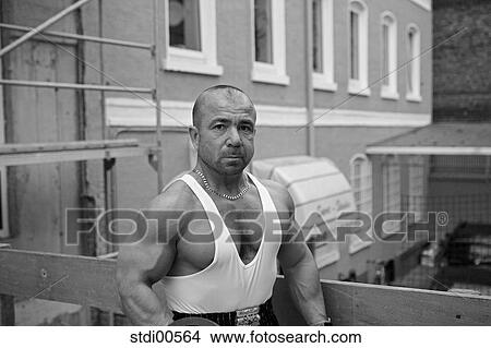 Picture - muscleman, teddy, build-up of muscles, strength training, bodybuilding, arms. Fotosearch
