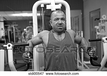 Stock Photo - muscleman, teddy, build-up of muscles, strength training, bodybuilding, arms. Fotosearch