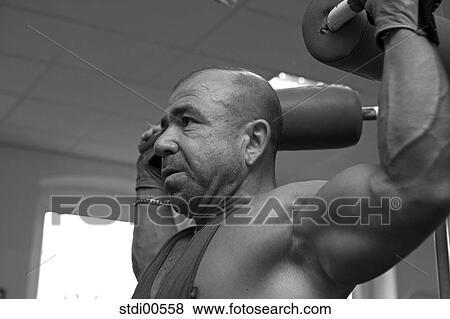 Stock Photo - muscleman, teddy, build-up of muscles, strength training, bodybuilding, arms. Fotosearch