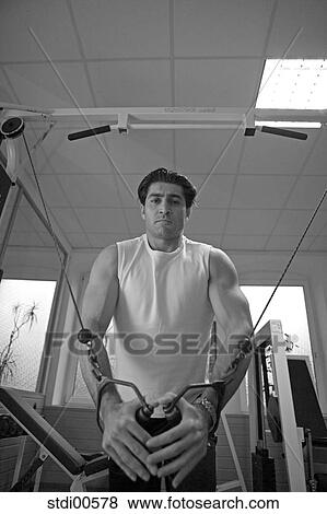 Stock Photo - muscleman, teddy, build-up of muscles, strength training, bodybuilding, arms. Fotosearch