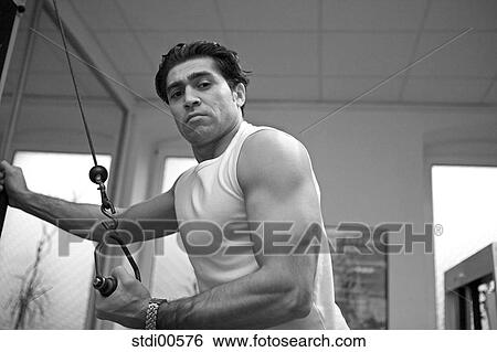 Stock Photograph - muscleman, teddy, build-up of muscles, strength training, bodybuilding, arms. Fotosearch