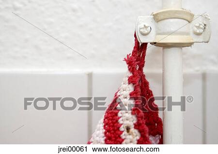 Stock Image - oven gloves, court, range, rag, pipe, redly, red. Fotosearch