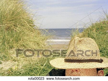 Stock Image - relaxed, beach, human, grass, woman, young. Fotosearch