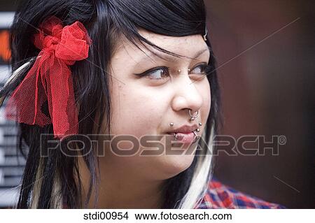 shop, woman, barrette, lip piercing, nose piercing, black hair, to tattoo View Large Photo Image Picture - shop, woman, barrette, lip piercing, nose piercing, black hair, to tattoo. Fotosearch