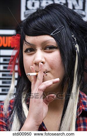shop, woman, barrette, lip piercing, nose piercing, black hair, to tattoo View Large Photo Image Stock Image - shop, woman, barrette, lip piercing, nose piercing, black hair, to tattoo. Fotosearch