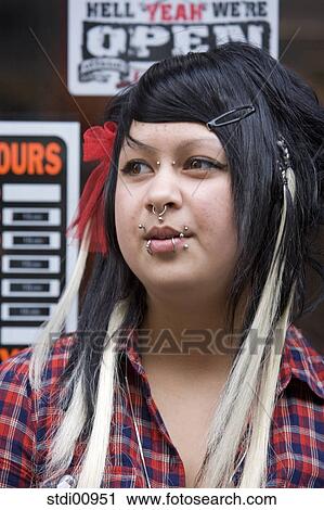 shop, woman, barrette, lip piercing, nose piercing, black hair, to tattoo View Large Photo Image Stock Image - shop, woman, barrette, lip piercing, nose piercing, black hair, to tattoo. Fotosearch