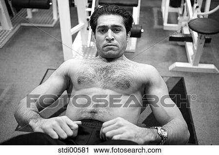 Stock Image - strength training, arms, bodybuilding, teddy, tummy muscle, abdominal muscles. Fotosearch