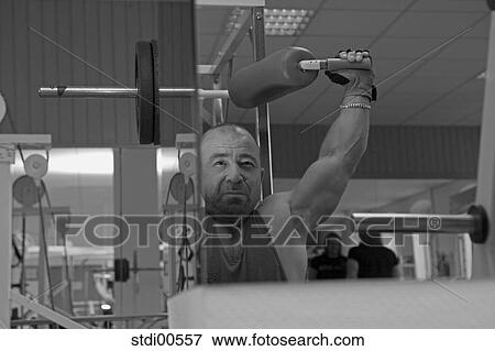 Stock Photo - strength training, teddy, muscleman, build-up of muscles, bodybuilding, arms. Fotosearch
