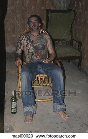 tattoo, bottle, rockingchair, waiting, thinking, reflective View Large Photo Image Stock Image - tattoo, bottle, rockingchair, waiting, thinking, reflective. Fotosearch