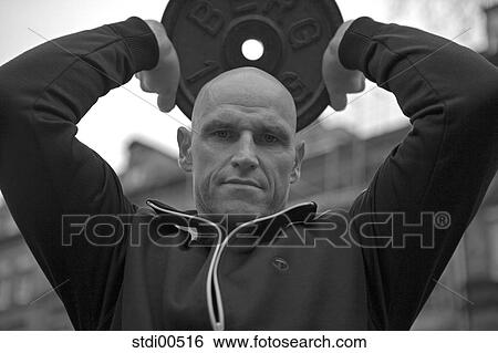 Stock Photograph - training, biceps, tracksuit top, training tool, bodybuilding, arms. Fotosearch