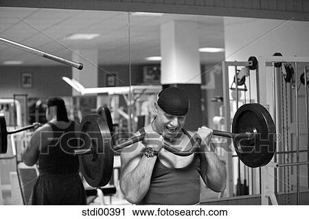 Stock Image - training, biceps, training tool, gold chain, bodybuilding, arms. Fotosearch