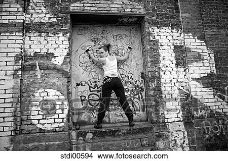 Picture - woman, arms, teddy, bodybuilding, graffiti, strength training, build-up of muscles. Fotosearch