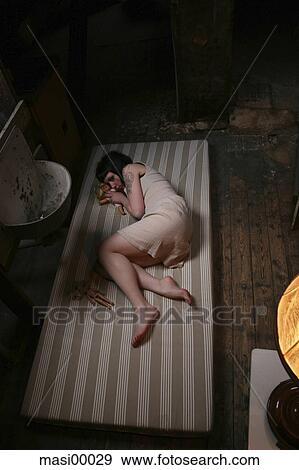 Stock Photo - woman, full body, resignation, doll, puppet, lamp, broken. Fotosearch