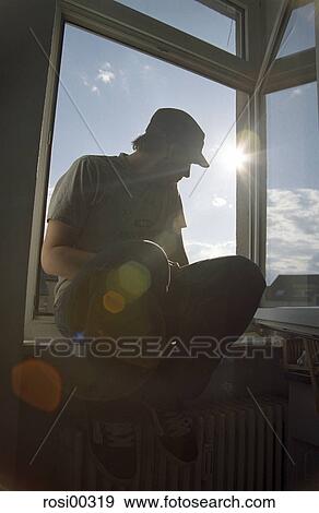 young, sitting, sits, back light, sun, sun spot View Large Photo Image Stock Photo - young, sitting, sits, back light, sun, sun spot. Fotosearch