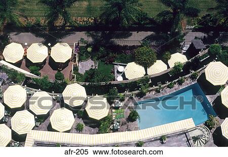 Stock Photography - Swimming Pool and Parasols Harare Zimbabwe. Fotosearch