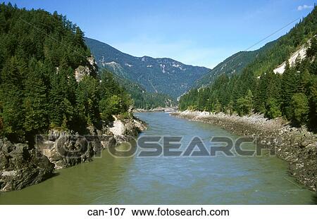 Stock Photo - Fraser River in Wooded Valley Canada. Fotosearch